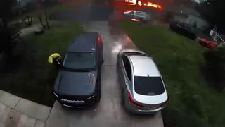 Lightning strike yards from woman exiting her car caught on camera