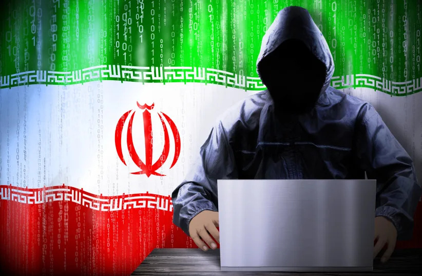 An illustration of a cyber hacker and the Iranian flag. (credit: PX Media/Shutterstock)
