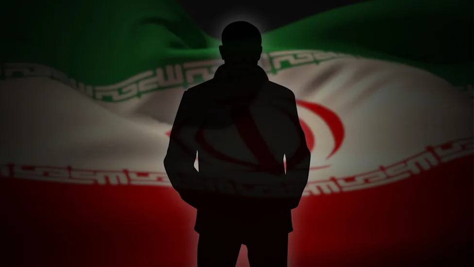 The silhouette of a person, with Iran